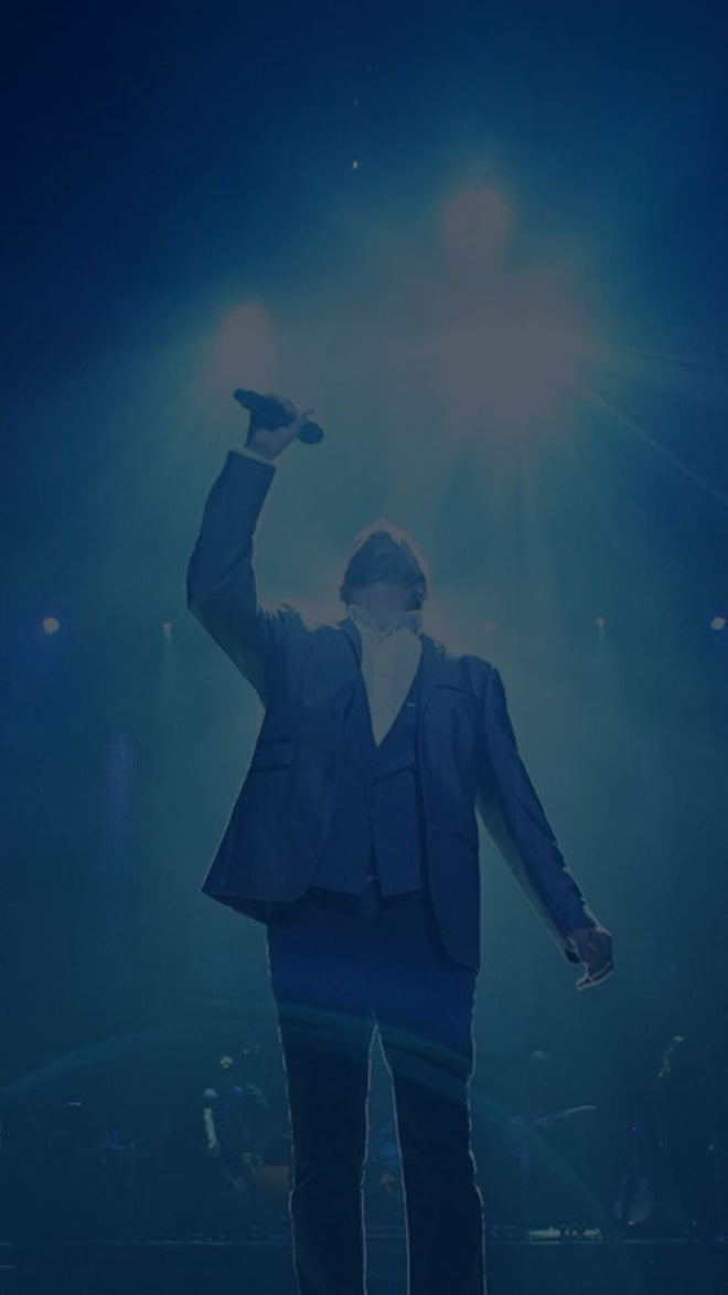 Clint Holmes on stage with microphone